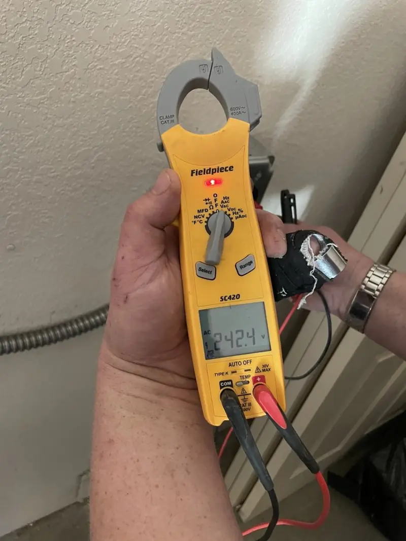 Voltage testing with clamp meter during Outlet Installation in Lewisboro